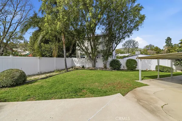 a view of backyard with green space