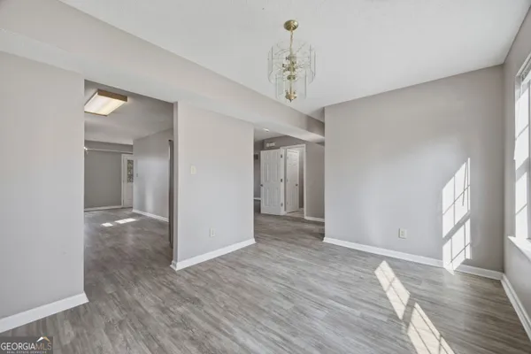 a view of livingroom with hardwood floor and kitchen view