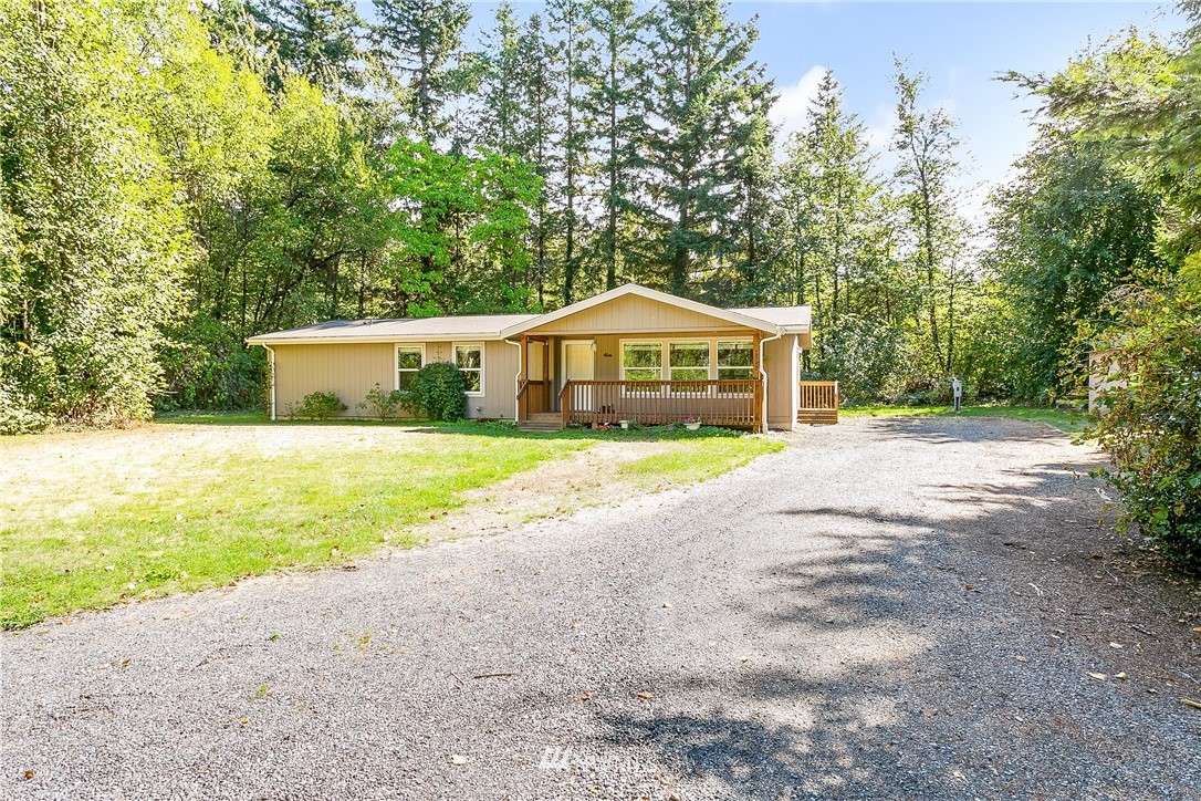 7592 Woodland Road Ferndale, WA 98248 - Photo 1 of 38 a view of house with outdoor space and swimming pool
