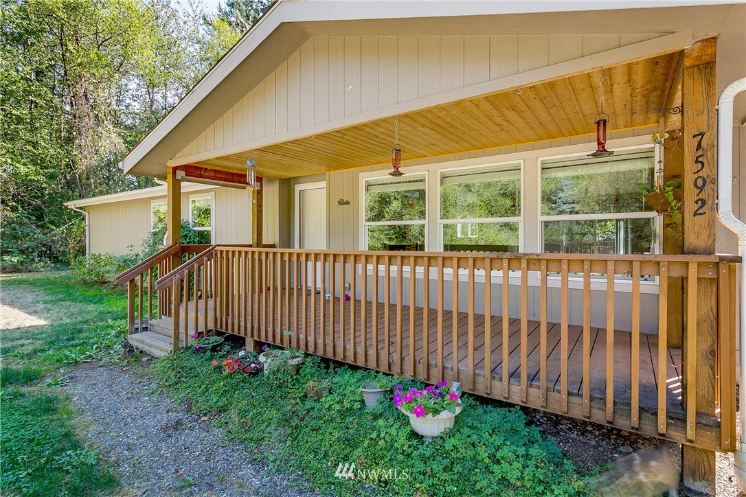 7592 Woodland Road Ferndale, WA 98248 - Photo 2 of 38 a view of a house with backyard and sitting area