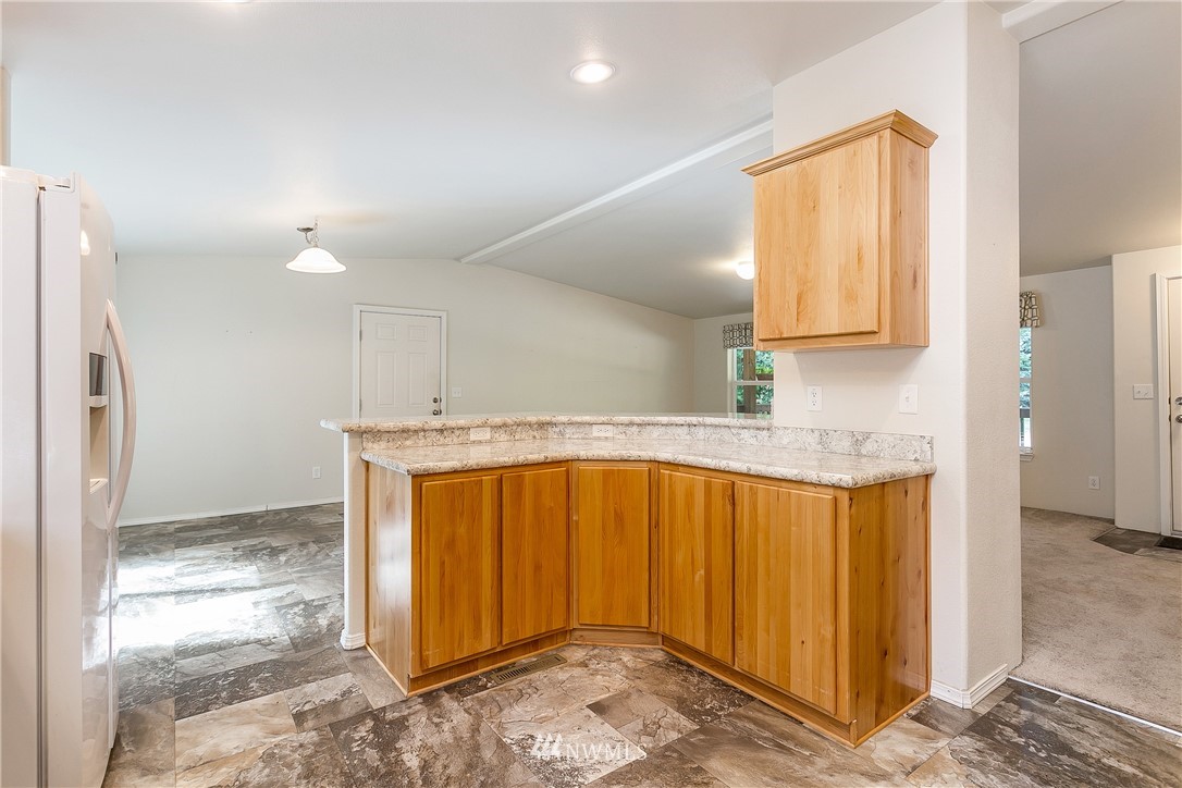 7592 Woodland Road Ferndale, WA 98248 - Photo 13 of 38 a bathroom with a sink and a mirror