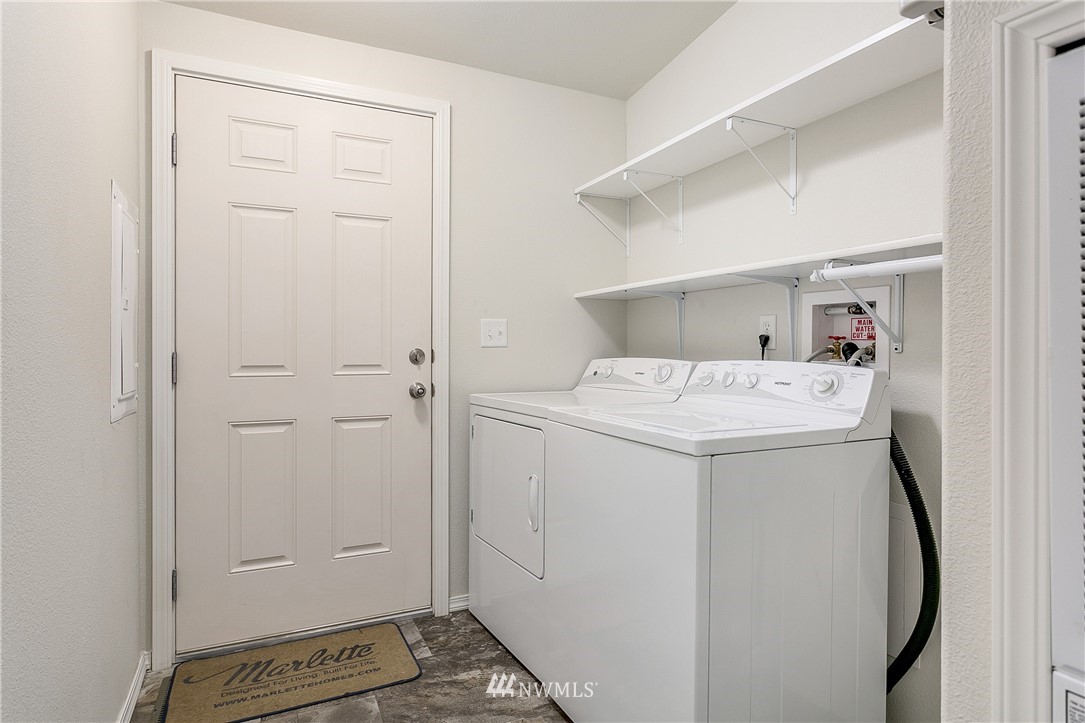 7592 Woodland Road Ferndale, WA 98248 - Photo 15 of 38 a utility room with dryer and washer