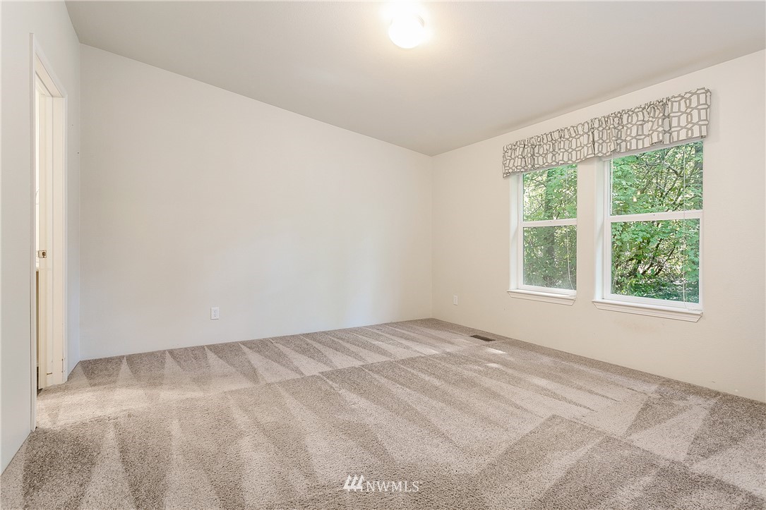 7592 Woodland Road Ferndale, WA 98248 - Photo 17 of 38 a view of an empty room with a window