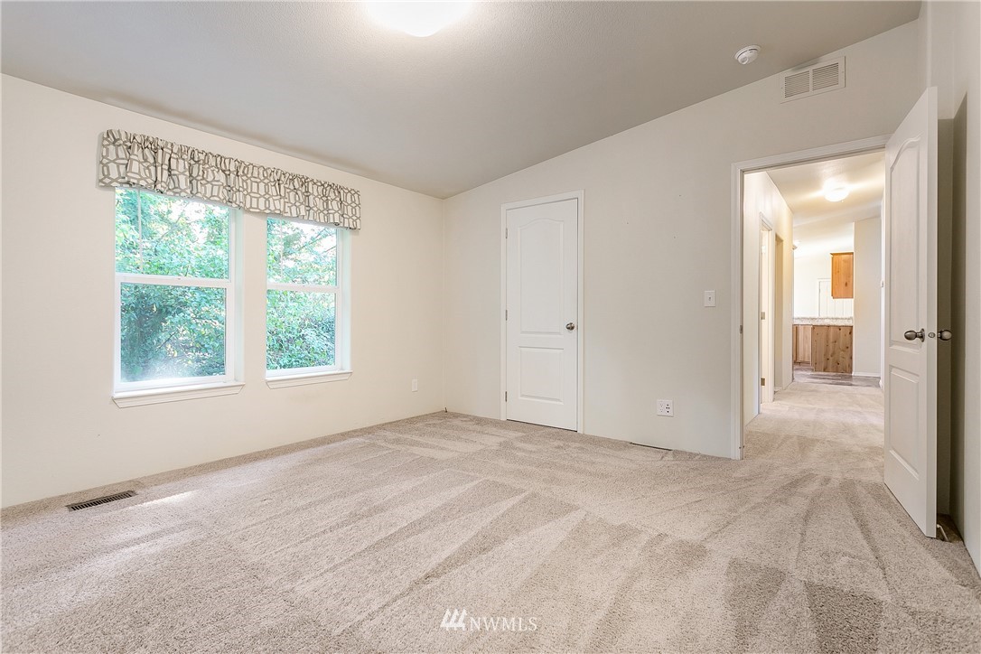 7592 Woodland Road Ferndale, WA 98248 - Photo 19 of 38 a view of an empty room with a window