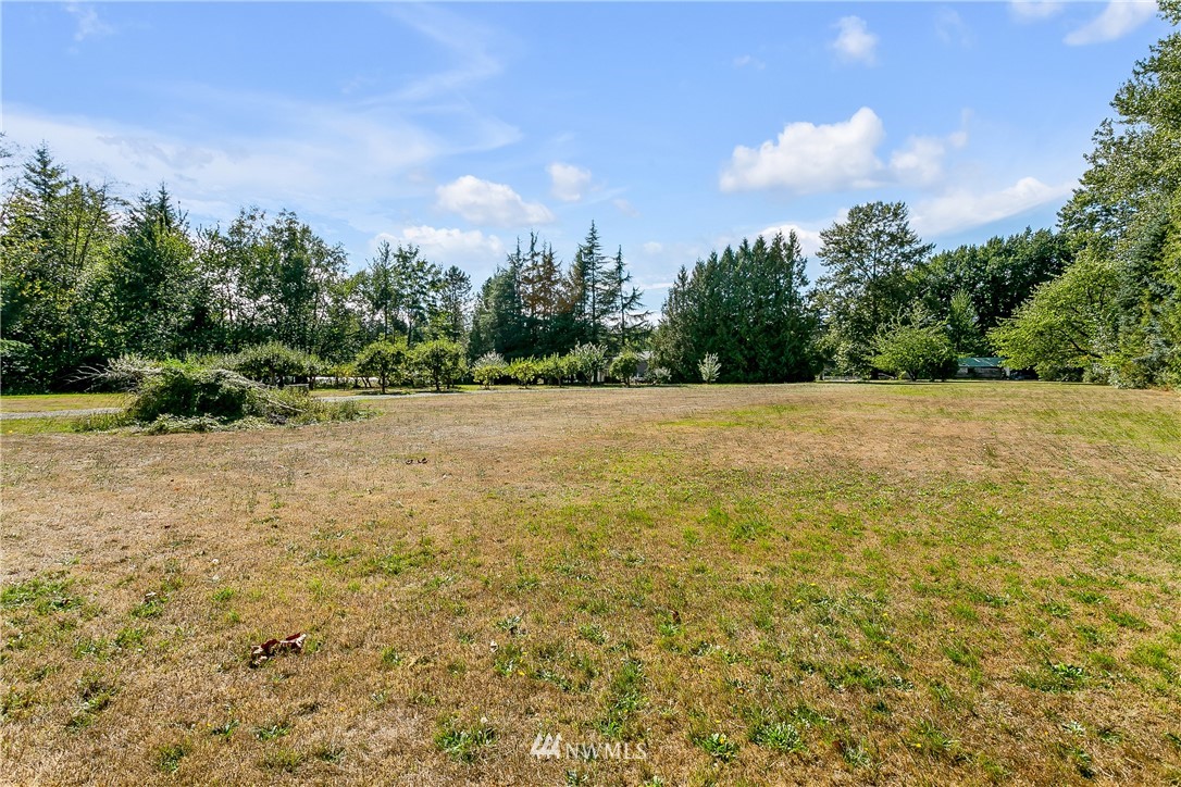 7592 Woodland Road Ferndale, WA 98248 - Photo 26 of 38 a view of yard with trees in background
