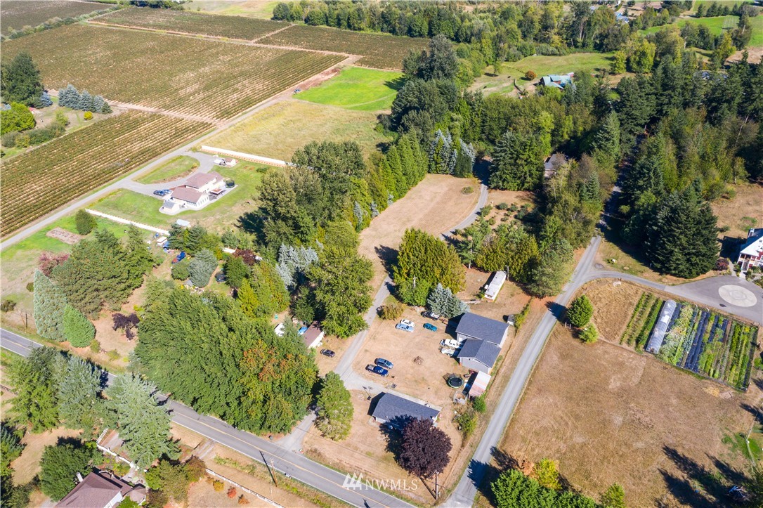 7592 Woodland Road Ferndale, WA 98248 - Photo 31 of 38 an aerial view of residential houses with outdoor space