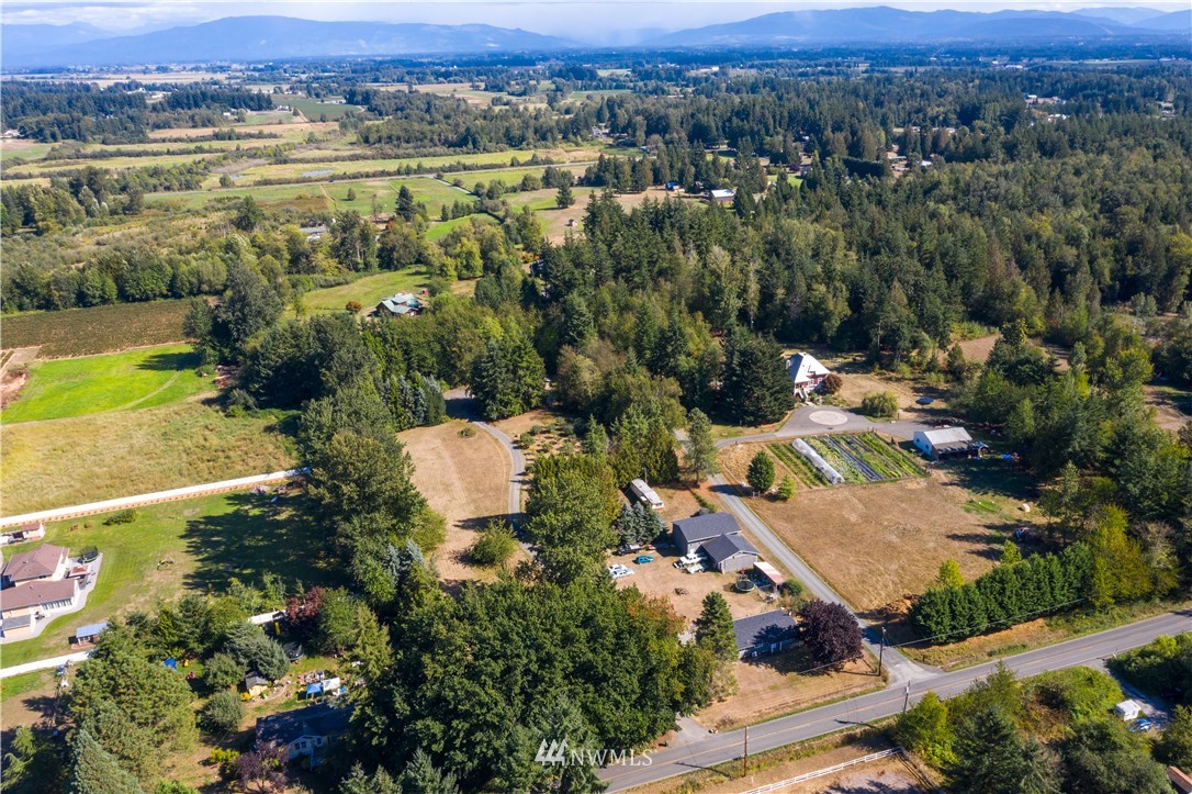 7592 Woodland Road Ferndale, WA 98248 - Photo 32 of 38 an aerial view of residential houses with outdoor space and river
