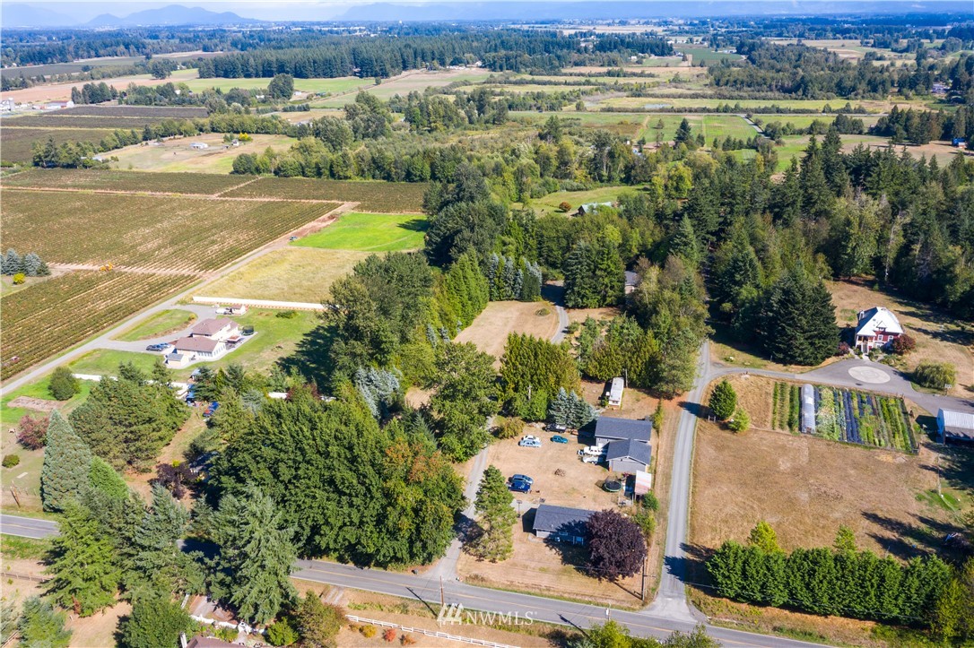 7592 Woodland Road Ferndale, WA 98248 - Photo 33 of 38 an aerial view of residential houses with outdoor space