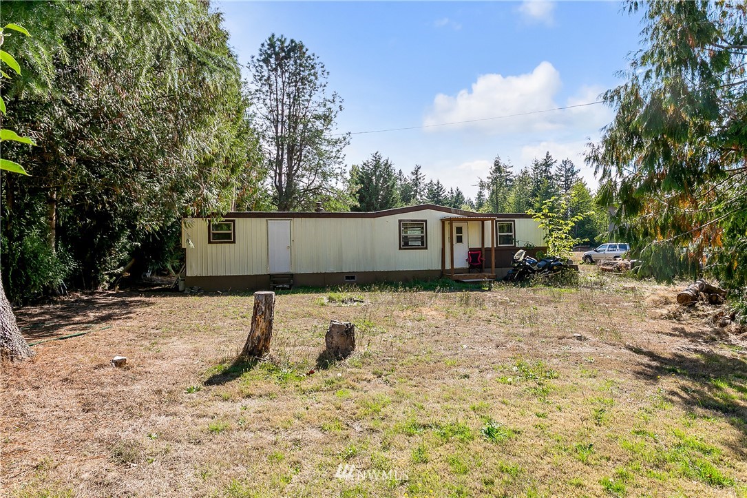 7592 Woodland Road Ferndale, WA 98248 - Photo 36 of 38 a view of a house with a yard