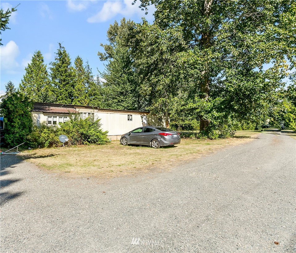 7592 Woodland Road Ferndale, WA 98248 - Photo 37 of 38 a car parked on the side of the road