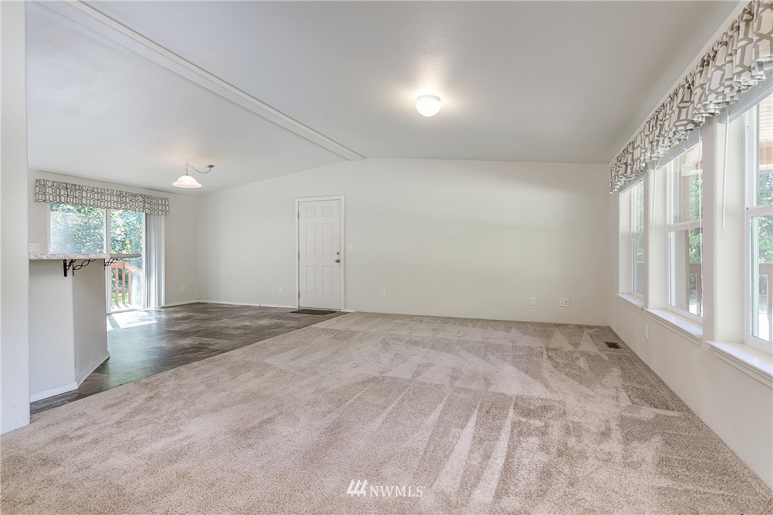 7592 Woodland Road Ferndale, WA 98248 - Photo 9 of 38 an empty room with windows