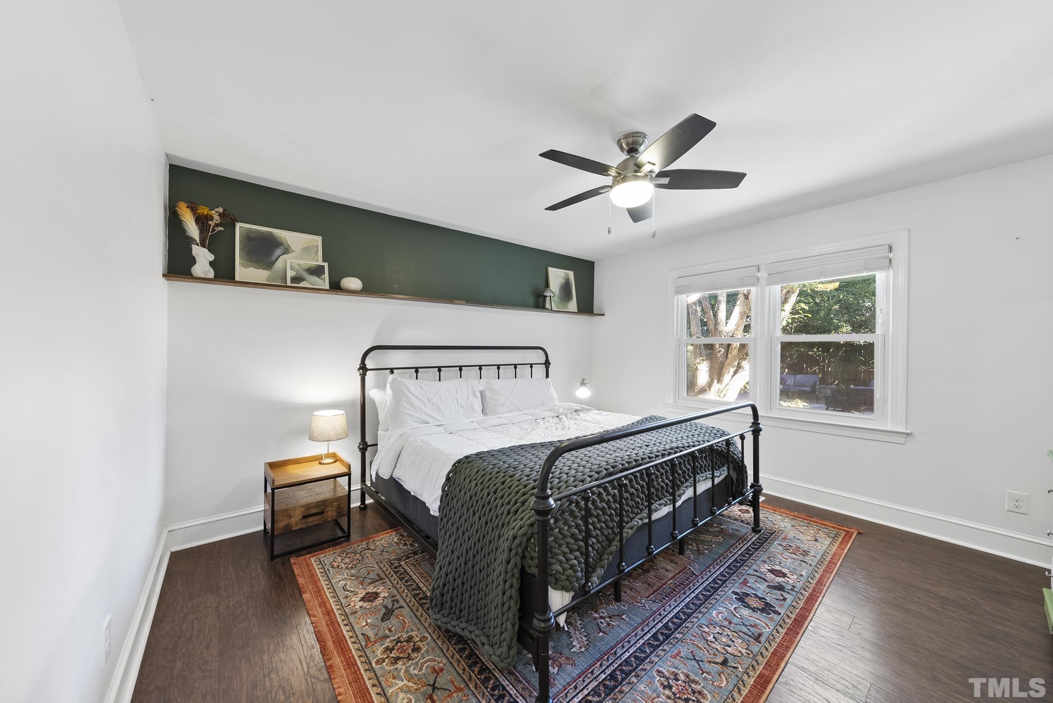 7516 Ray Road Raleigh, NC 27613 - Photo 15 of 23 a bedroom with a bed and a window