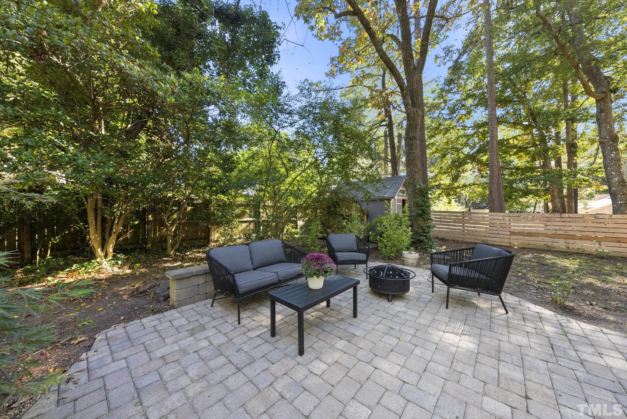7516 Ray Road Raleigh, NC 27613 - Photo 18 of 23 a view of a patio with couches and a fire pit
