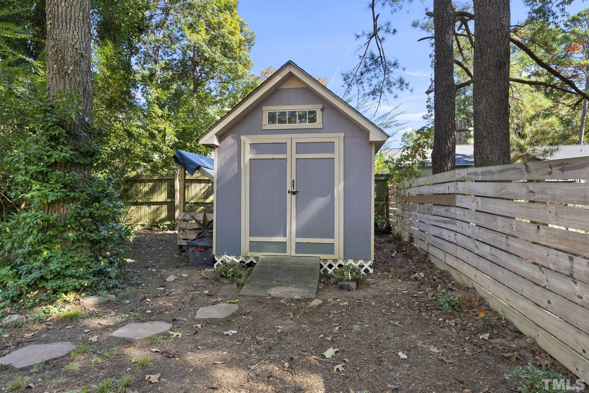 7516 Ray Road Raleigh, NC 27613 - Photo 19 of 23 a front view of house with yard and trees in the background
