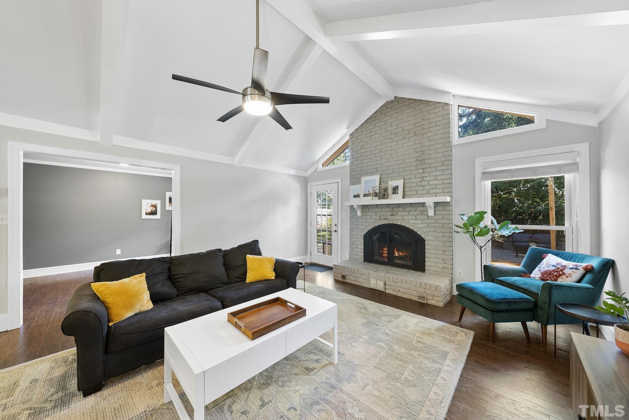 7516 Ray Road Raleigh, NC 27613 - Photo 2 of 23 a living room with furniture and a fireplace
