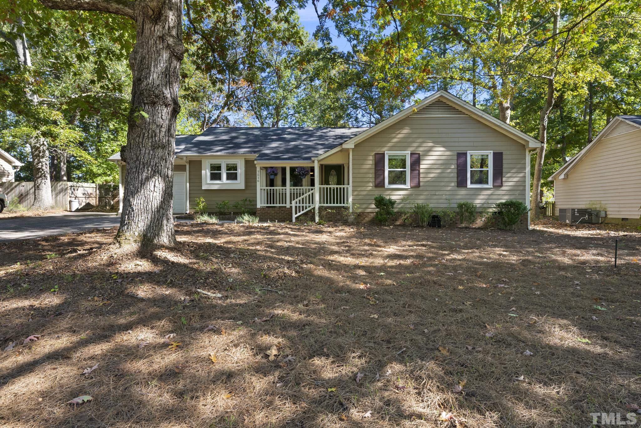 7516 Ray Road Raleigh, NC 27613 - Photo 21 of 23 a front view of a house with garden