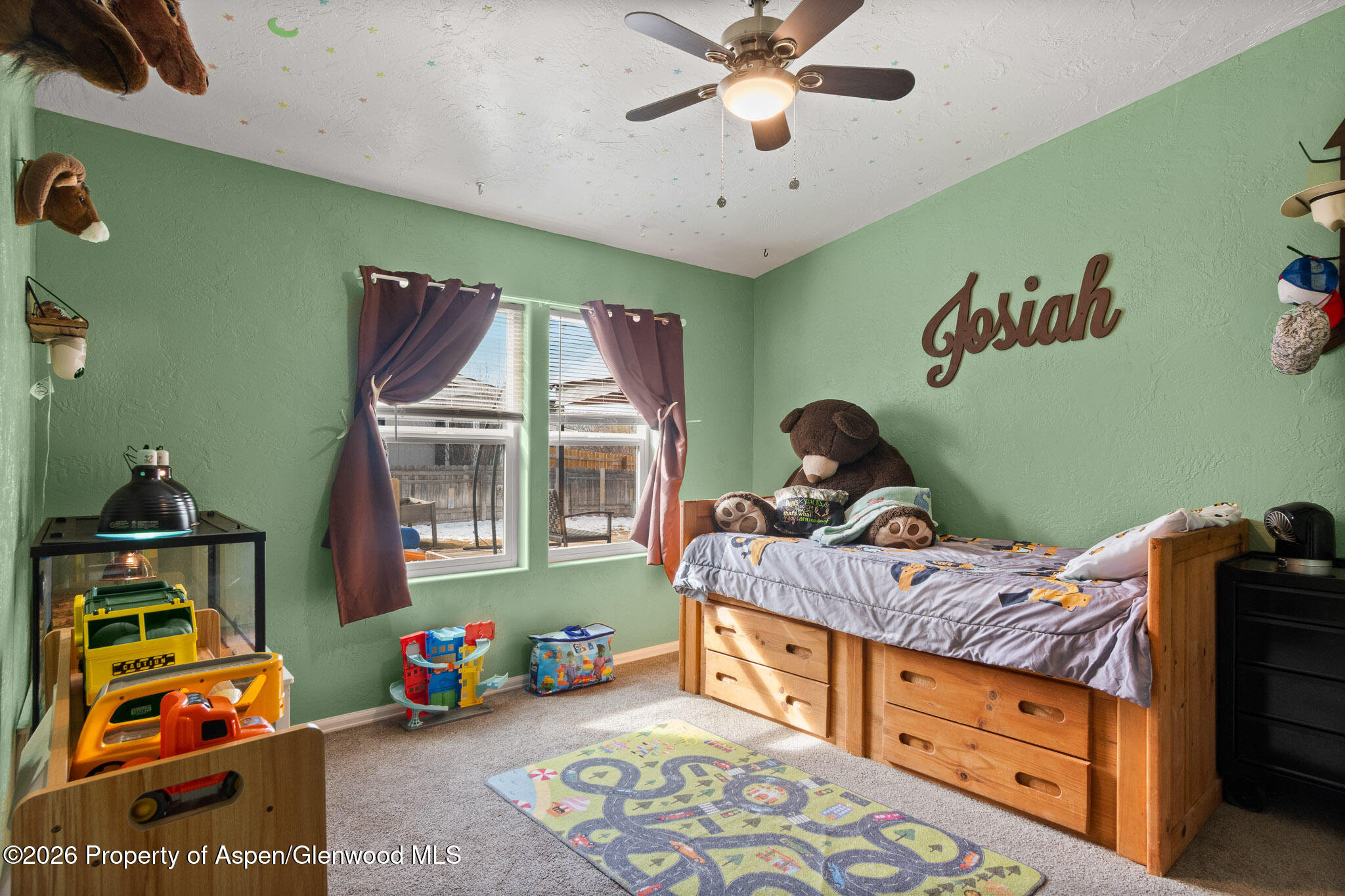 106 Cedar Circle Parachute, CO 81635 - Photo 14 of 35 a bedroom with a bed and a window