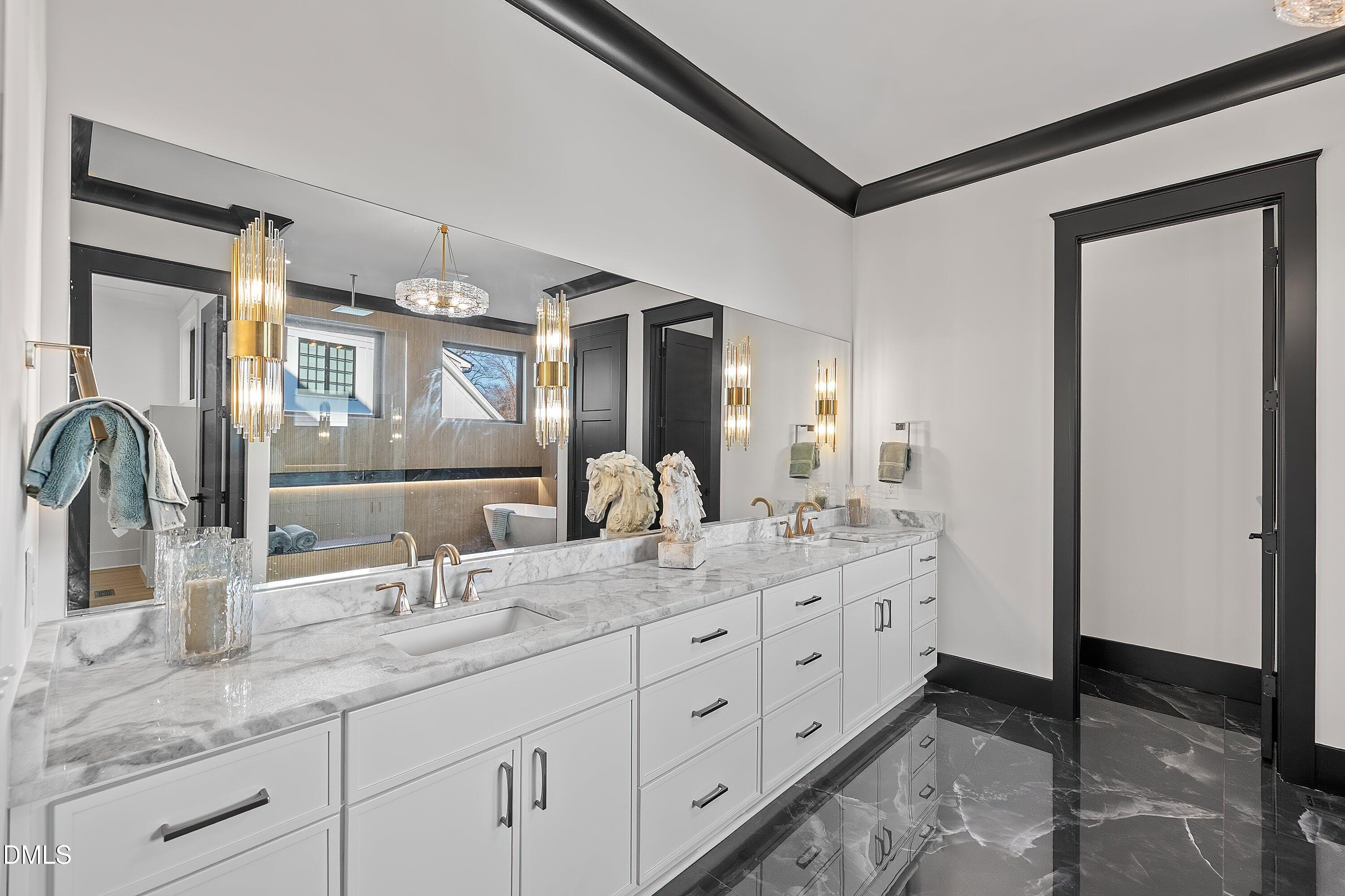 1312 Hunting Ridge Road Raleigh, NC 27615 - Photo 18 of 95 a bathroom with double sink and a mirror