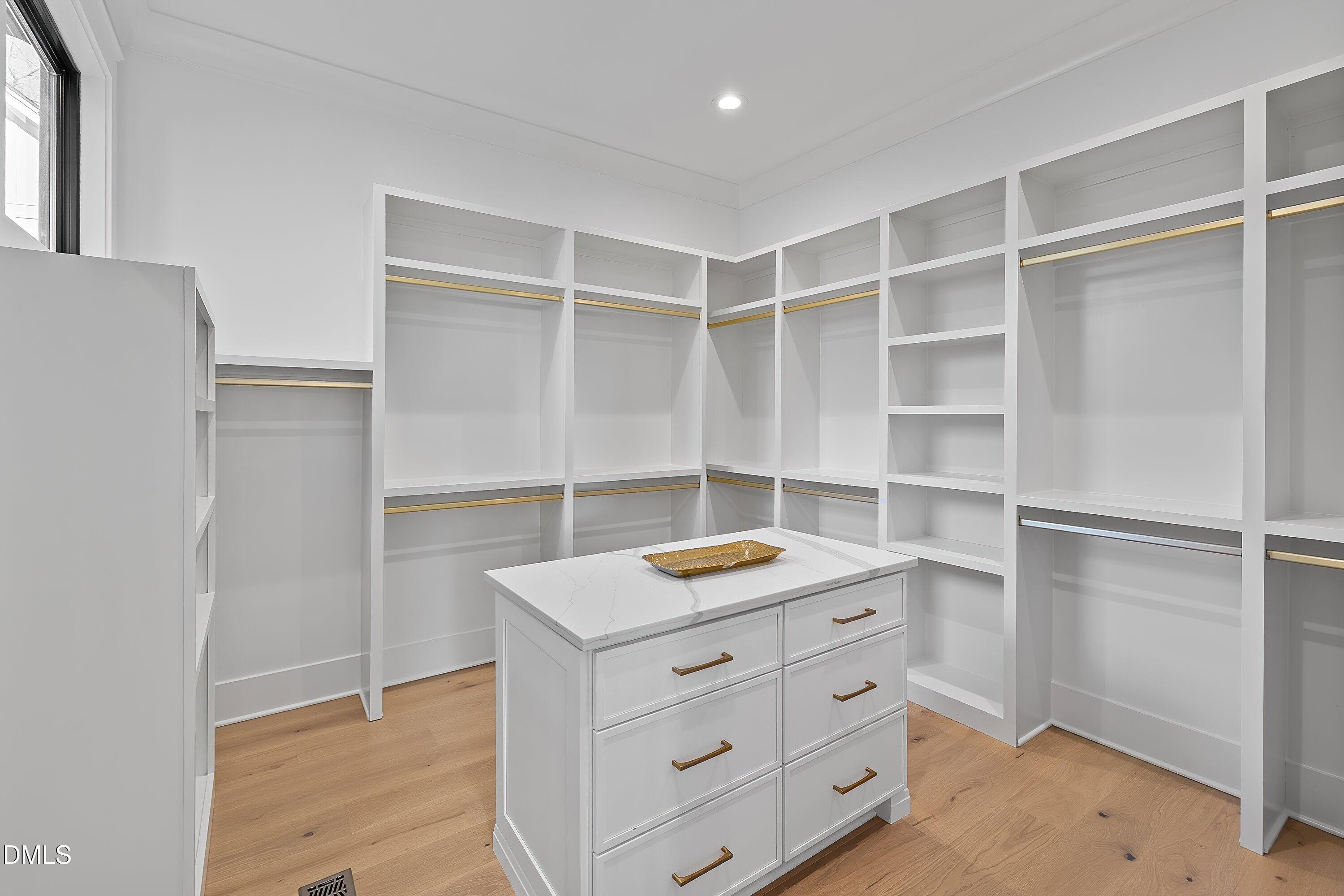 1312 Hunting Ridge Road Raleigh, NC 27615 - Photo 20 of 95 a kitchen with cabinets and shelf
