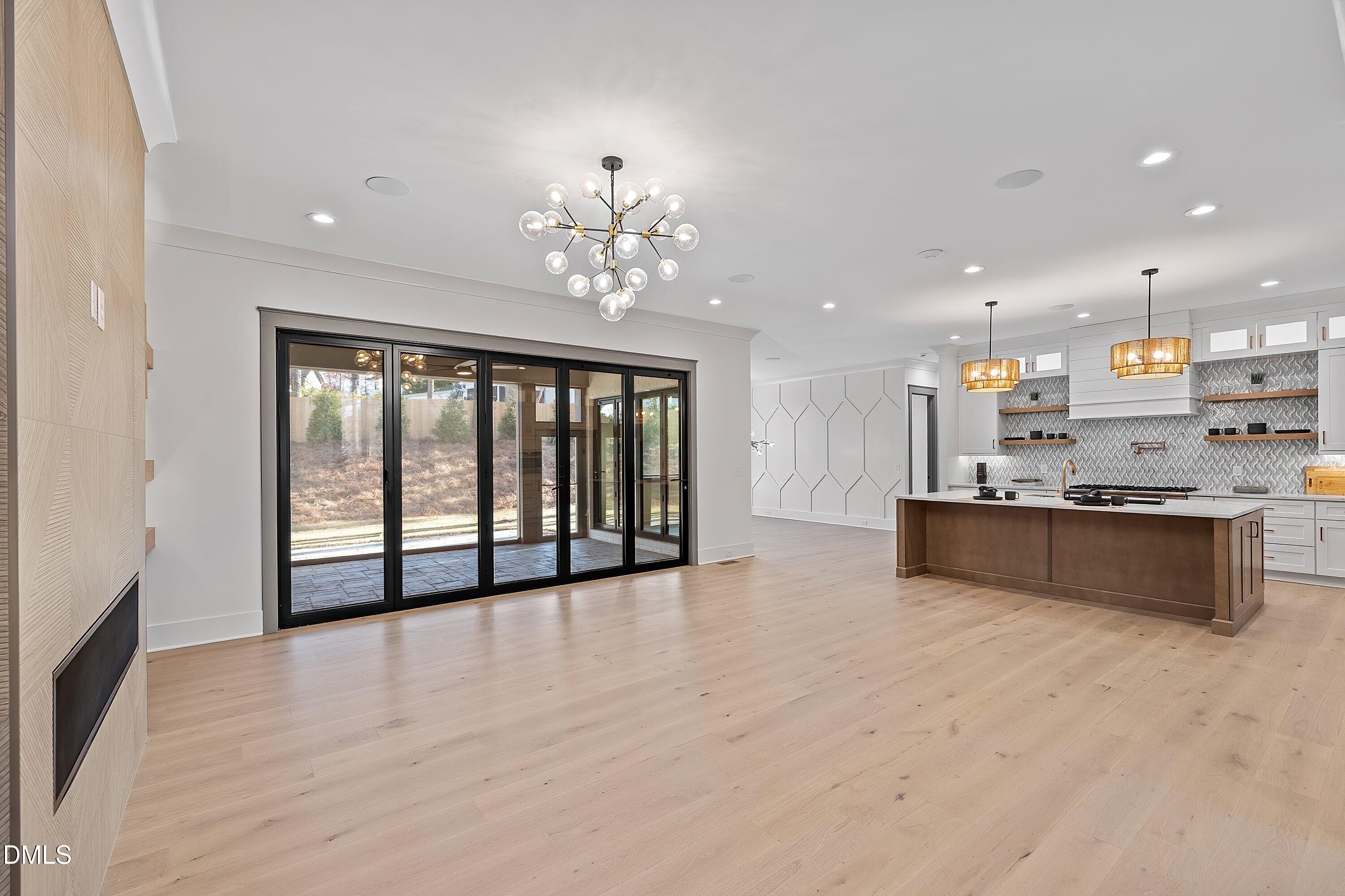 1312 Hunting Ridge Road Raleigh, NC 27615 - Photo 21 of 95 a view of an empty room with a kitchen