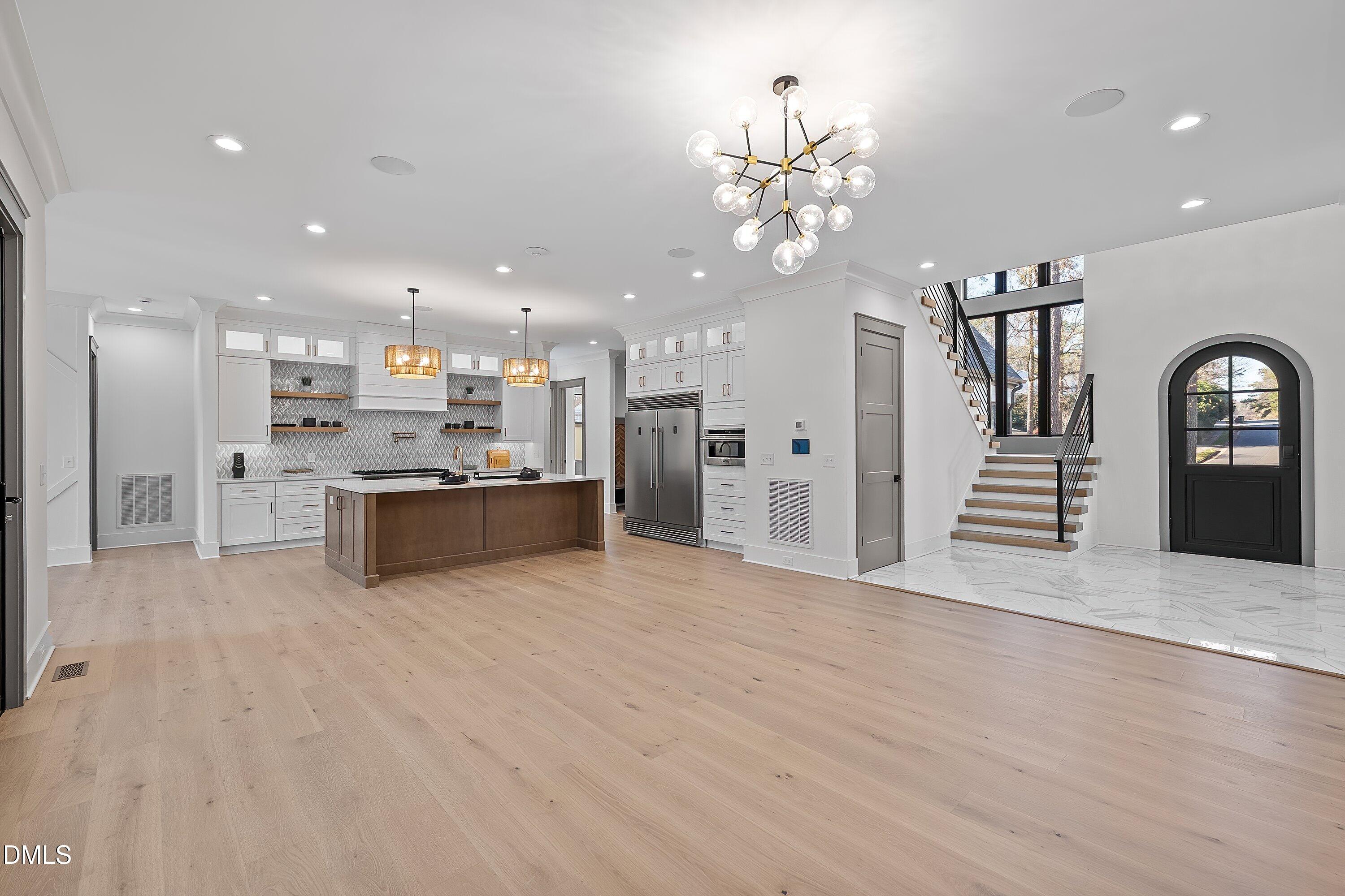 1312 Hunting Ridge Road Raleigh, NC 27615 - Photo 23 of 95 a view of a kitchen with a sink and refrigerator