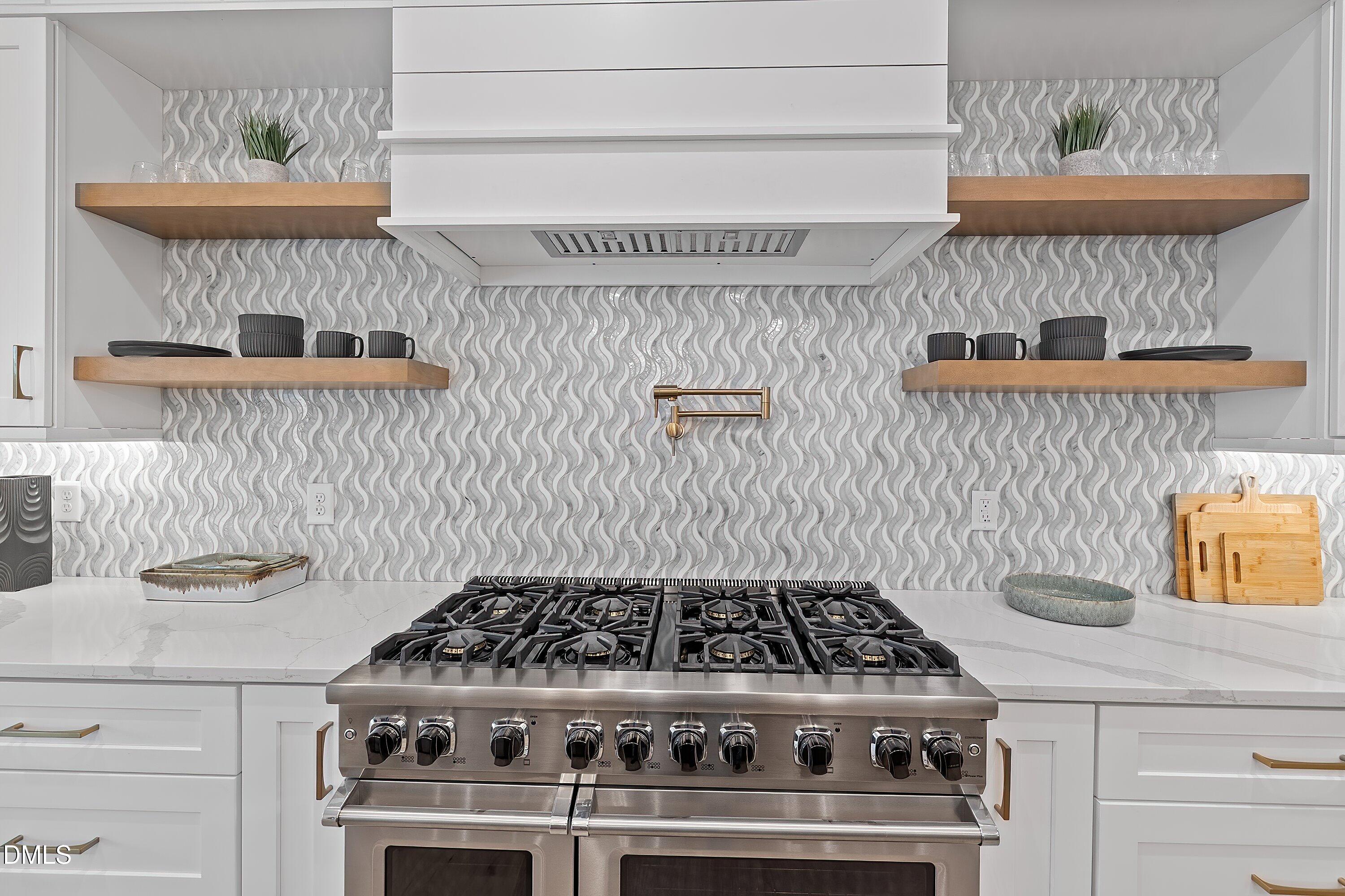 1312 Hunting Ridge Road Raleigh, NC 27615 - Photo 29 of 95 a white stove top oven sitting inside of a kitchen