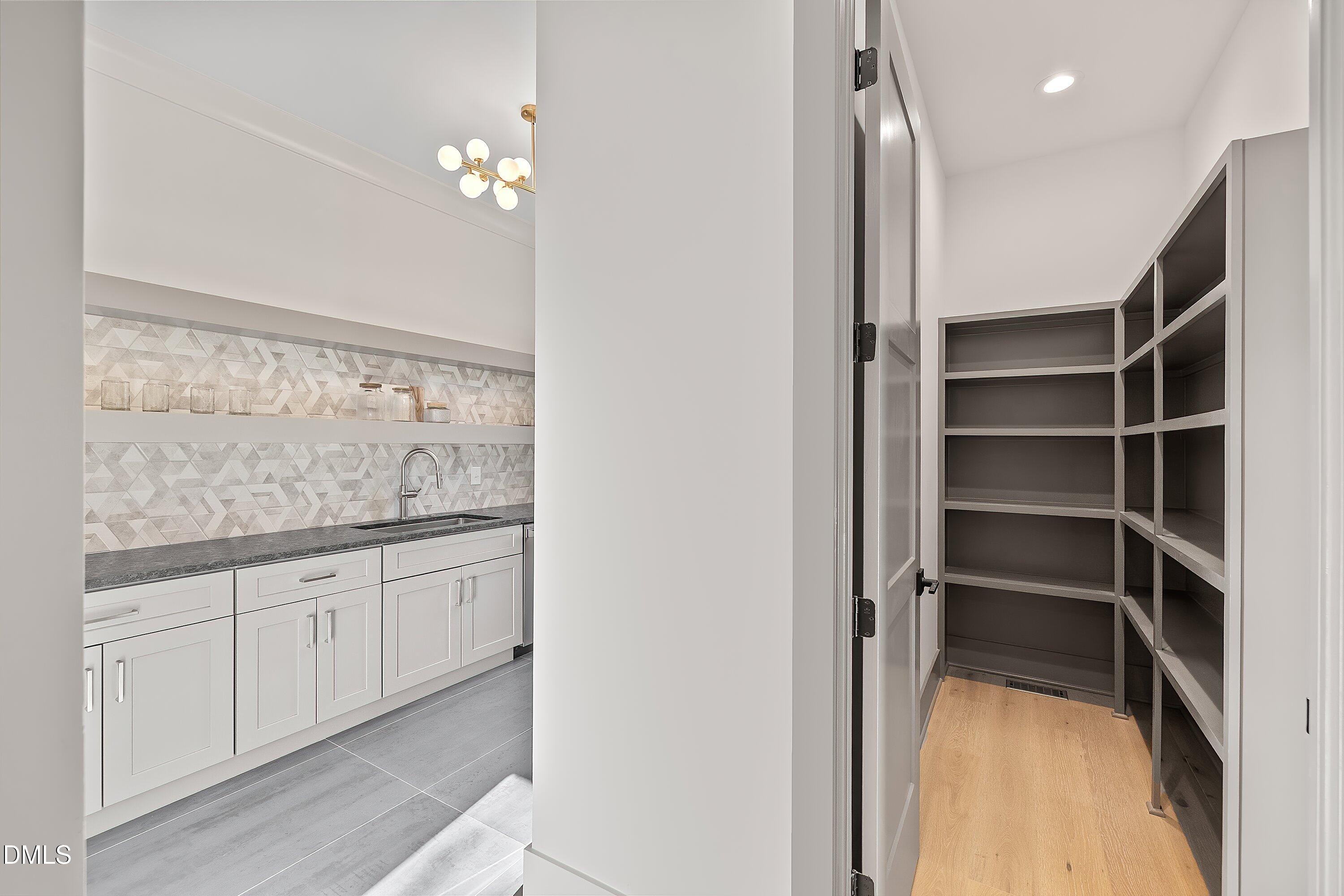 1312 Hunting Ridge Road Raleigh, NC 27615 - Photo 50 of 95 a view of an empty room with cabinet and a window