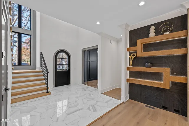 a view of an empty room with a kitchen