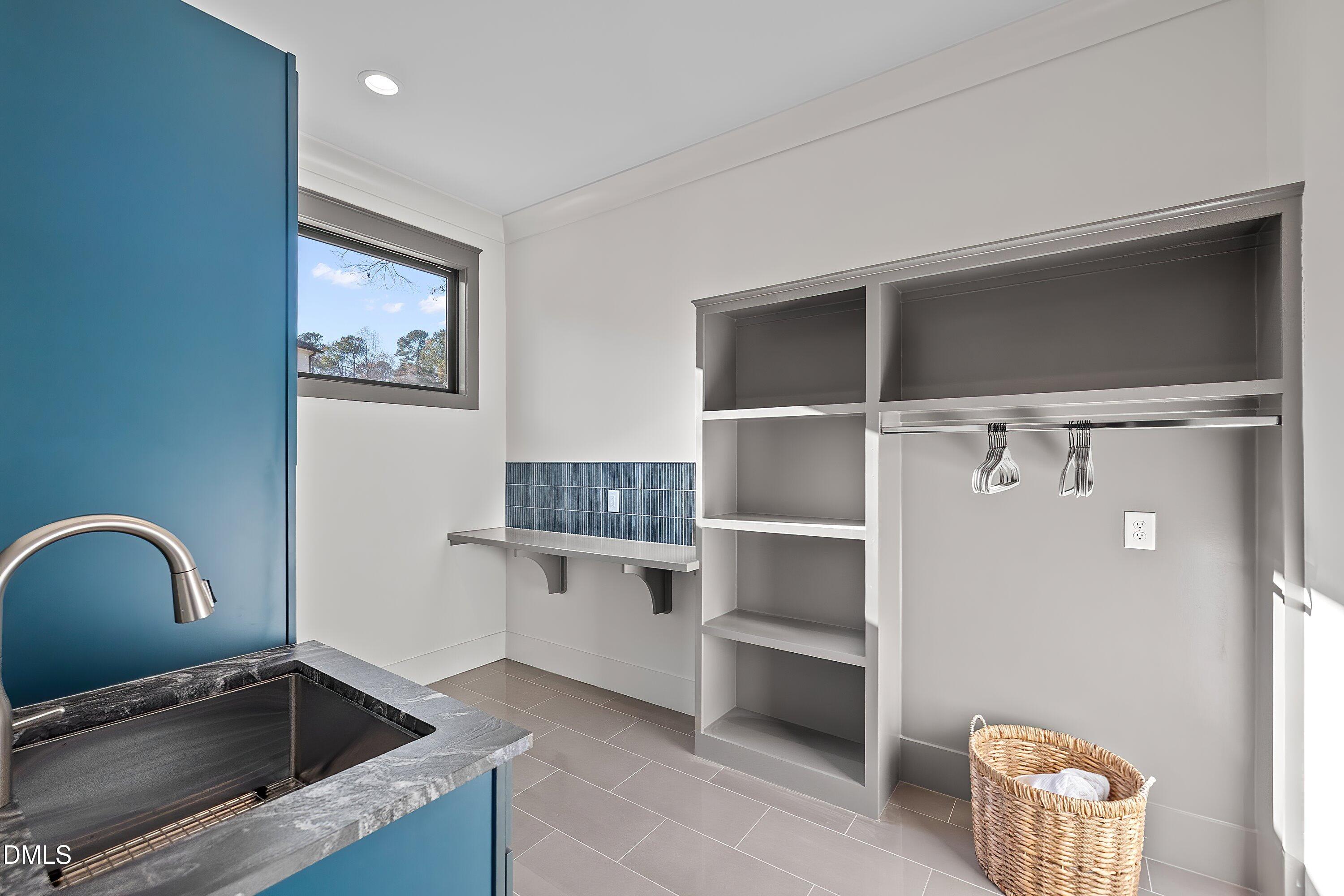 1312 Hunting Ridge Road Raleigh, NC 27615 - Photo 53 of 95 a view of cabinets and window