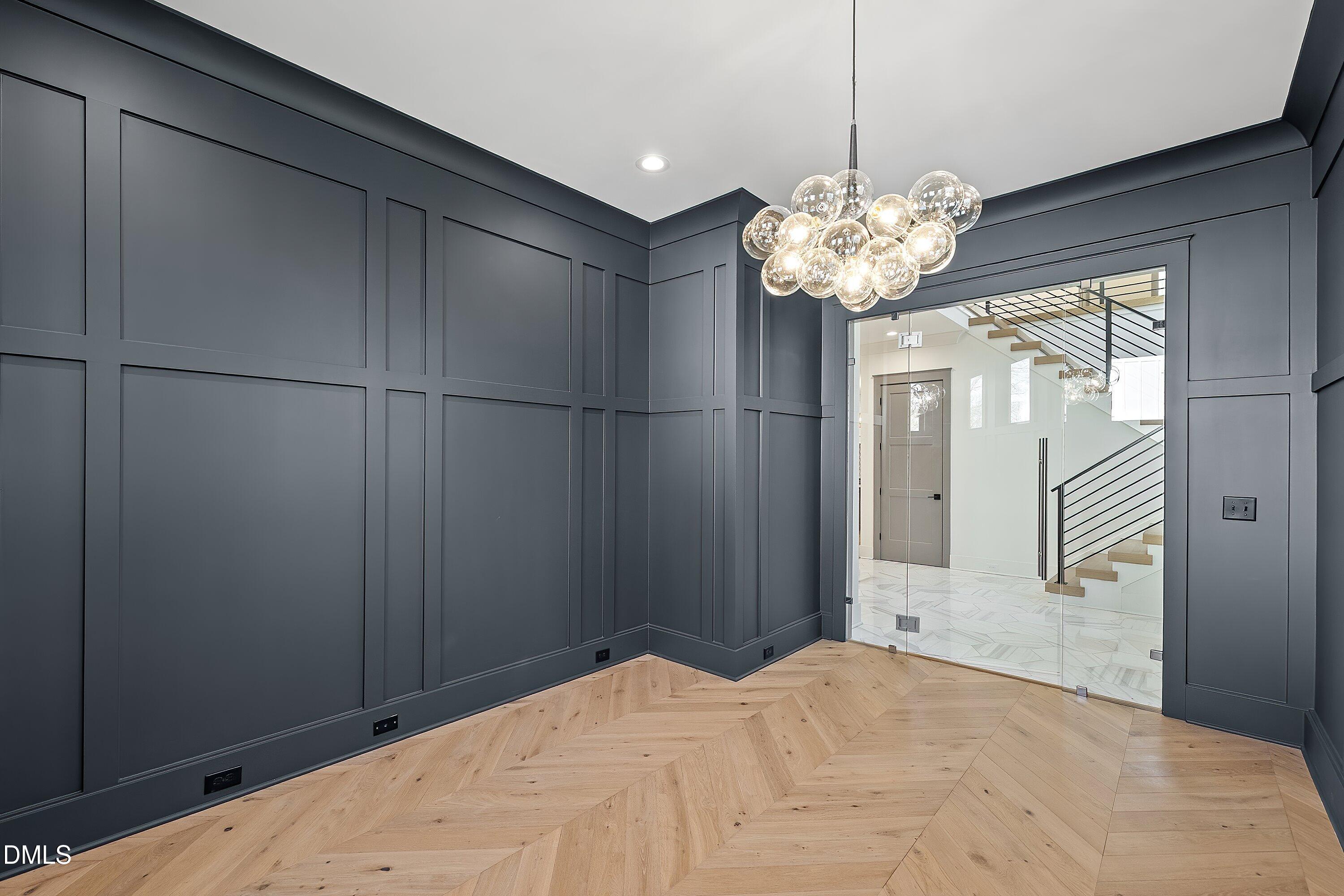 1312 Hunting Ridge Road Raleigh, NC 27615 - Photo 8 of 95 a view of a chandelier fan and closet