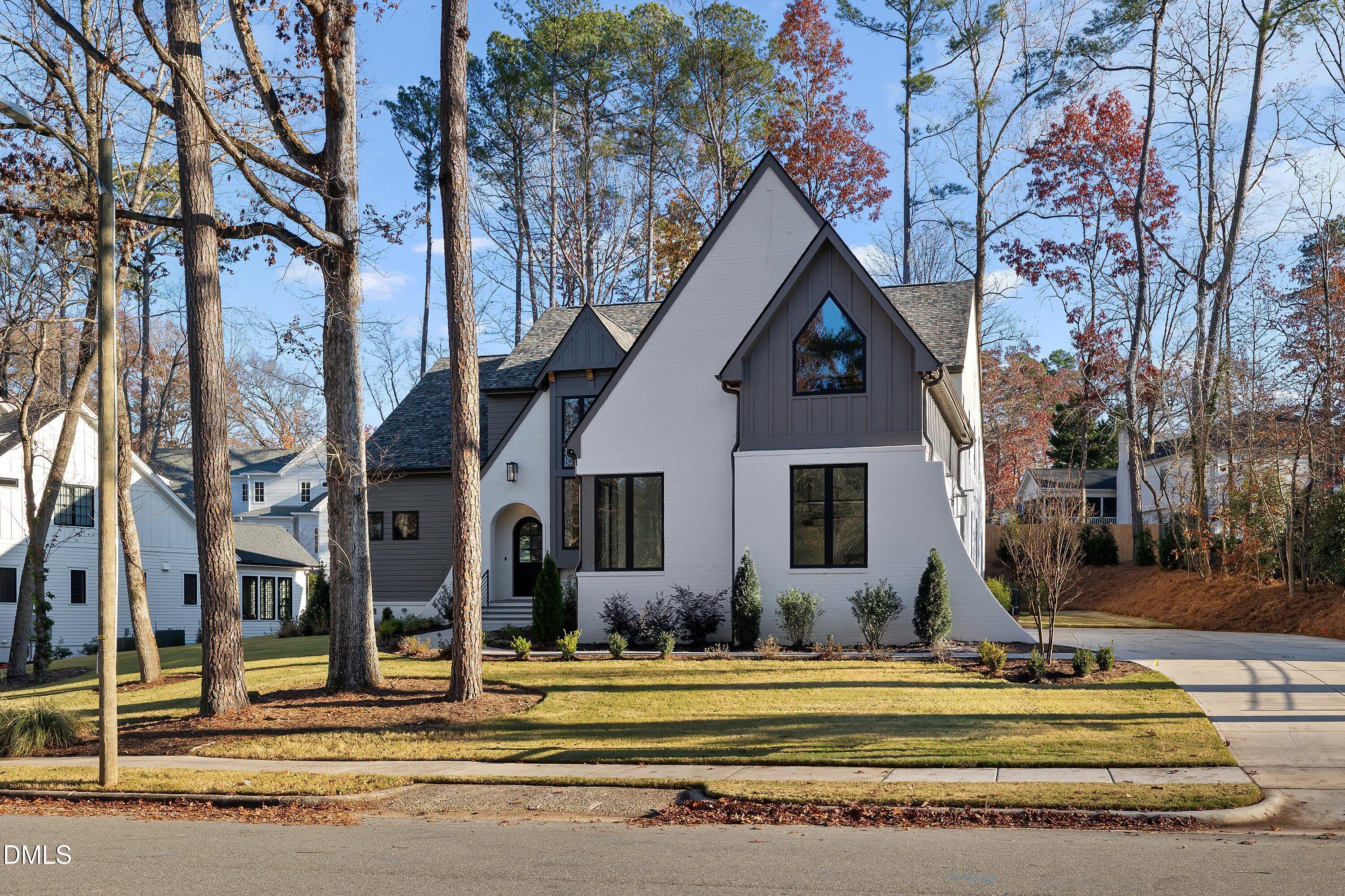 1312 Hunting Ridge Road Raleigh, NC 27615 - Photo 85 of 95 a front view of a house with a yard