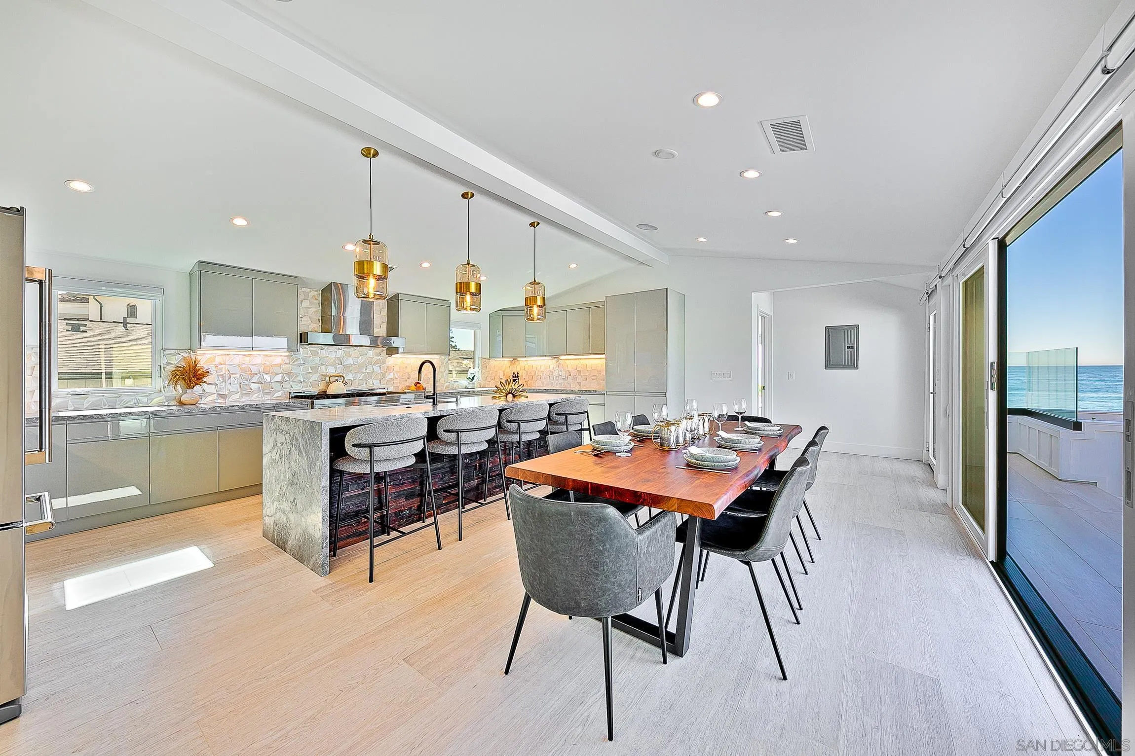303 Sea Lane La Jolla, CA 92037 - Photo 11 of 61 a dining room with a table and chairs