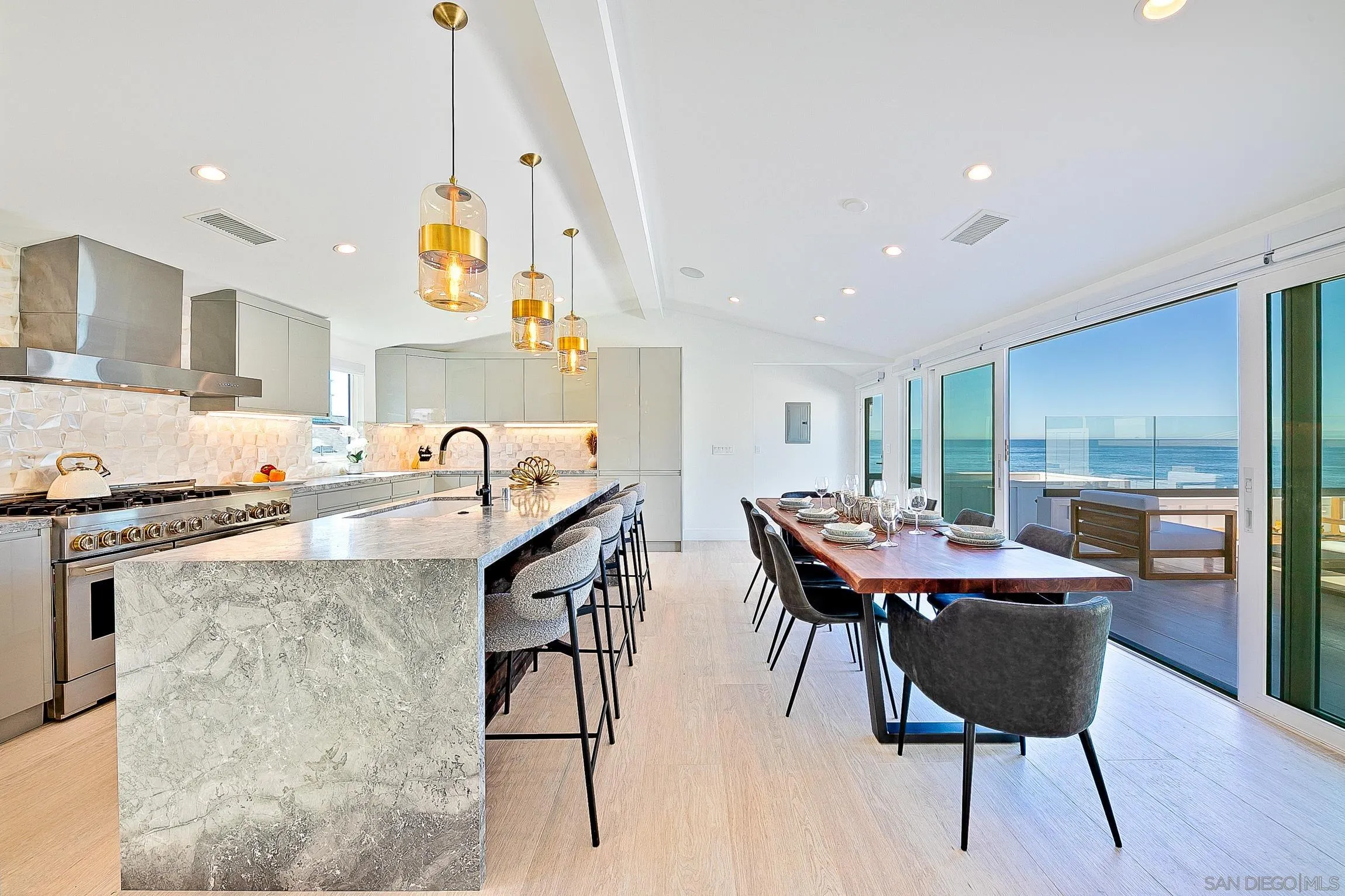303 Sea Lane La Jolla, CA 92037 - Photo 12 of 61 a view of a dining room with furniture and wooden floor