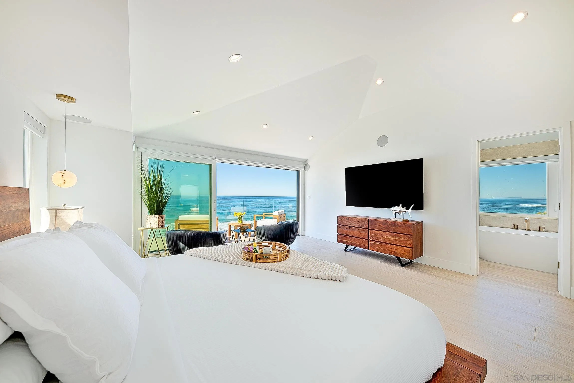 303 Sea Lane La Jolla, CA 92037 - Photo 22 of 61 a bedroom with a bed and a flat screen tv