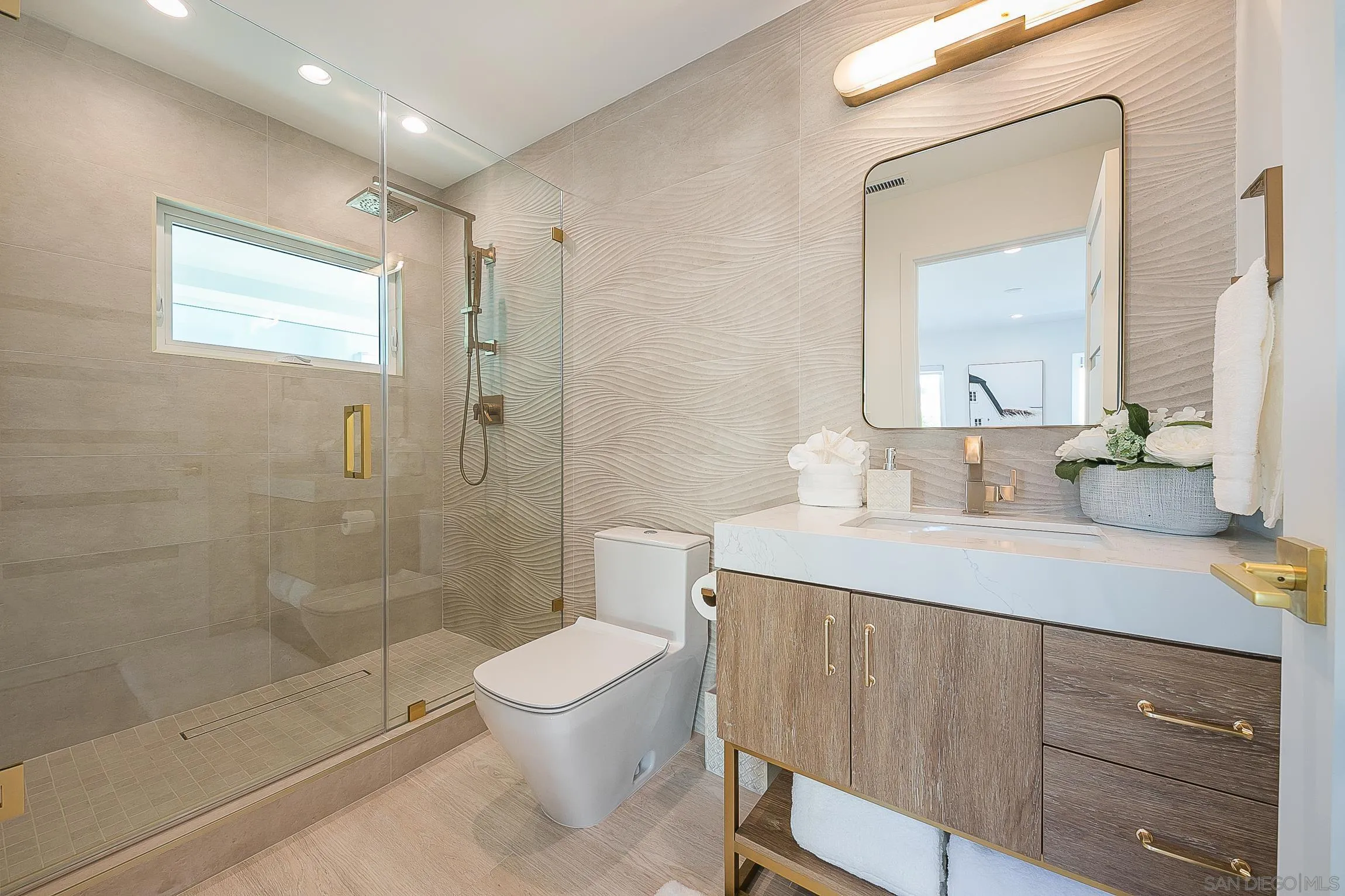 303 Sea Lane La Jolla, CA 92037 - Photo 32 of 61 a bathroom with a sink a toilet and shower