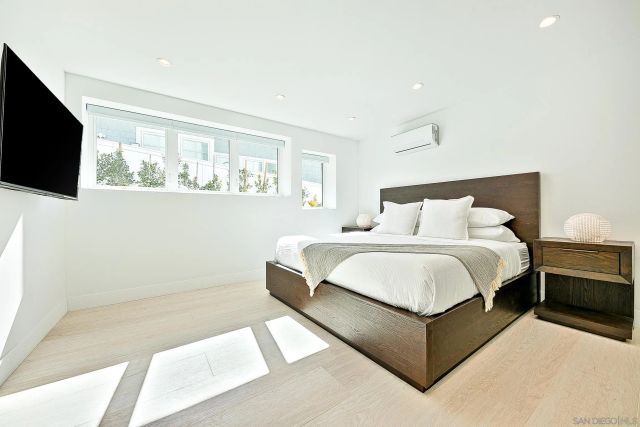 a bathroom with a double vanity sink and mirror