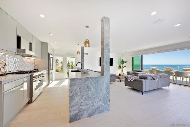 a dining table with chairs and a wooden floor