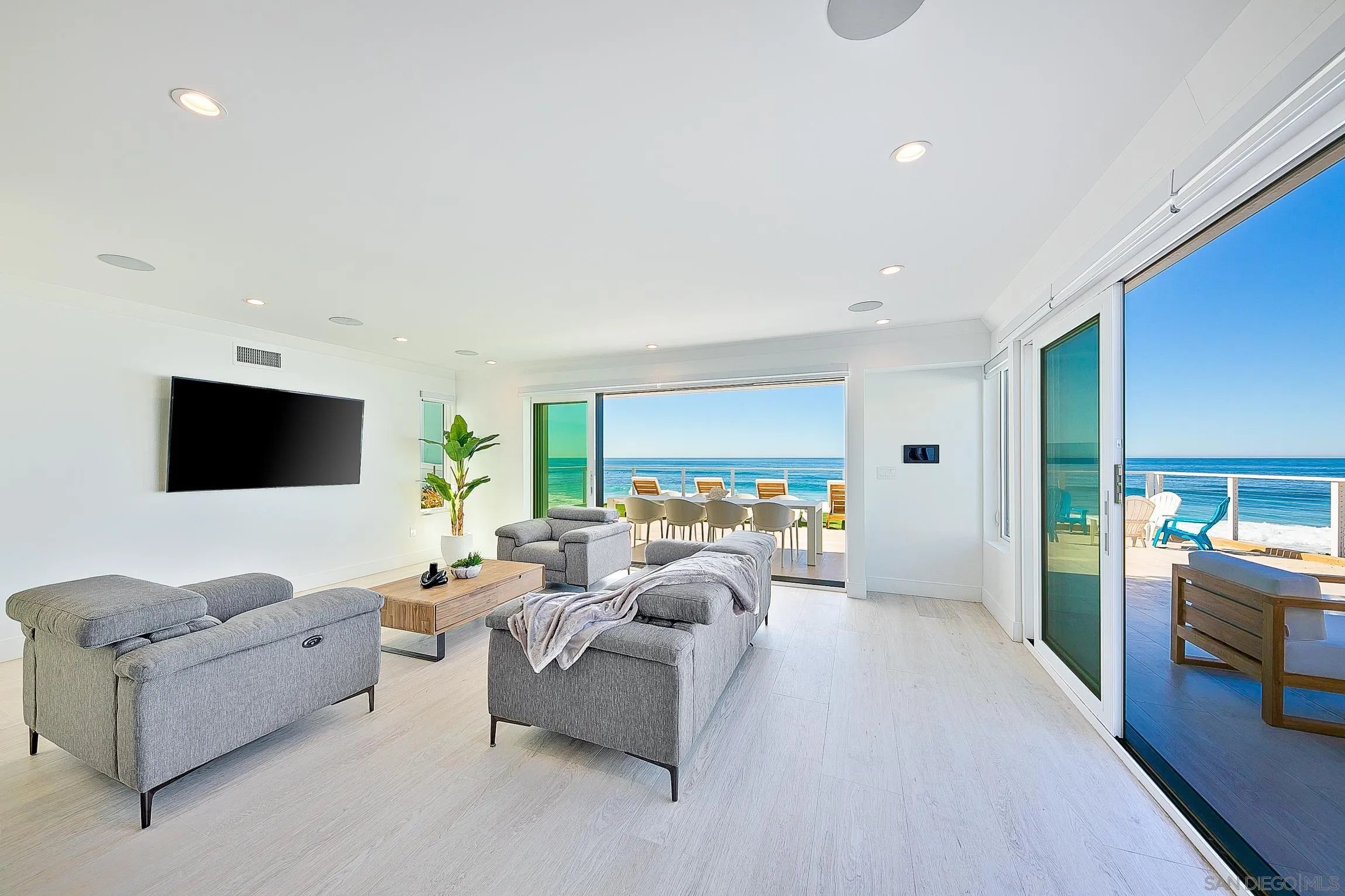 303 Sea Lane La Jolla, CA 92037 - Photo 43 of 61 a living room with furniture and a flat screen tv