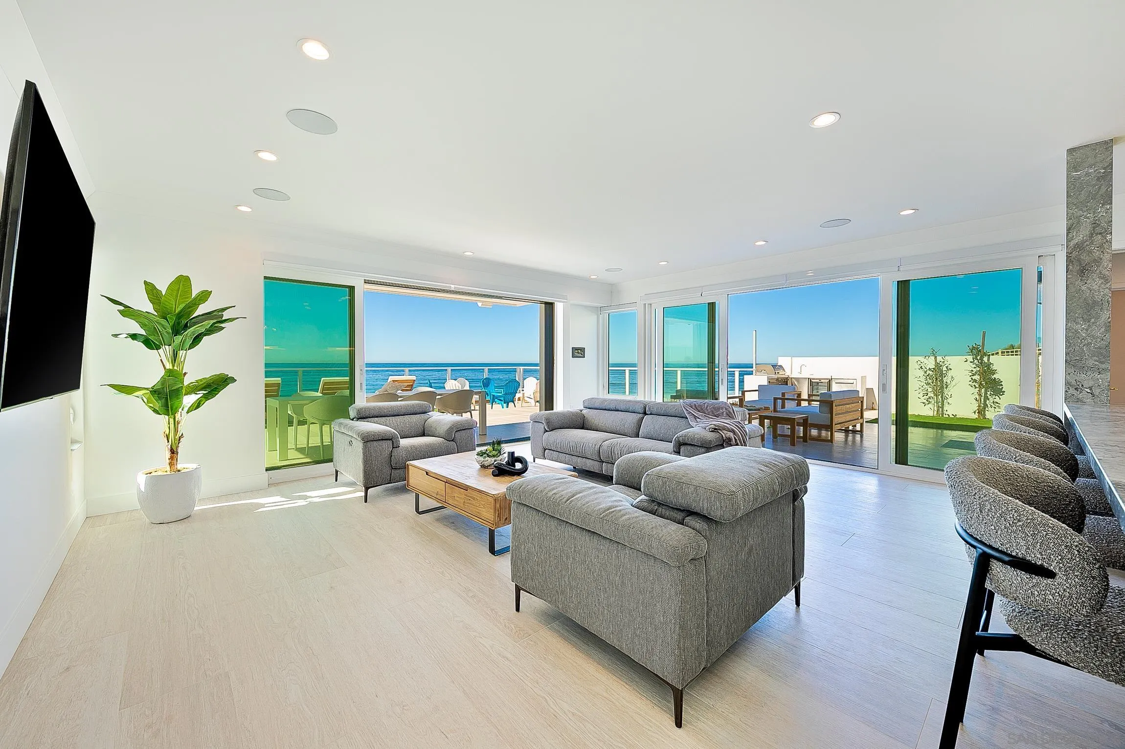 303 Sea Lane La Jolla, CA 92037 - Photo 44 of 61 a living room with furniture and a potted plant