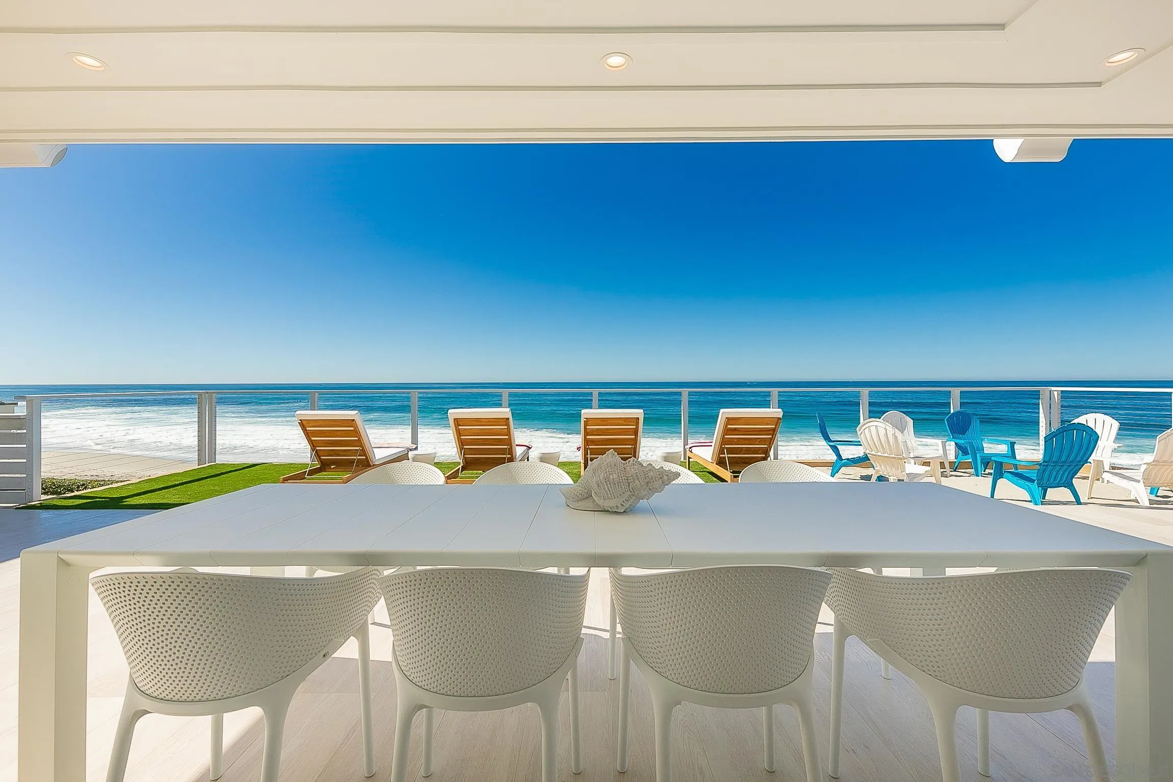 303 Sea Lane La Jolla, CA 92037 - Photo 50 of 61 a dining table with chairs and a wooden floor
