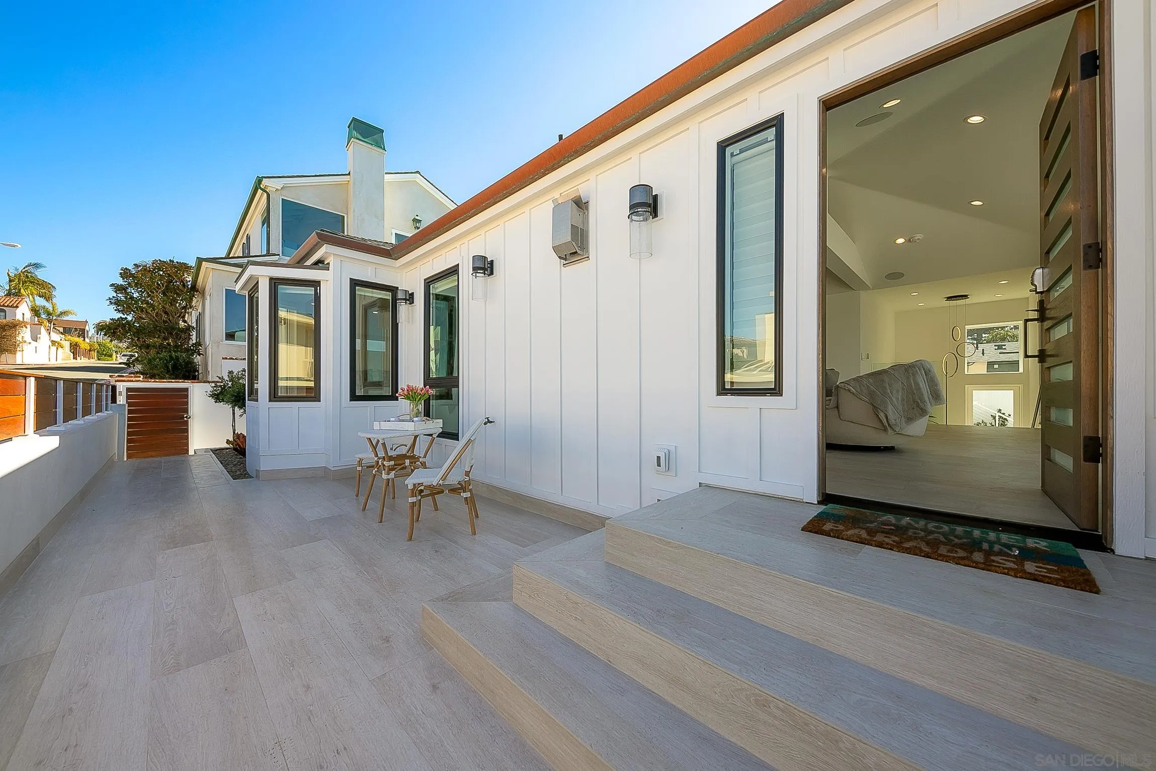 303 Sea Lane La Jolla, CA 92037 - Photo 6 of 61 a front view of a house with a yard