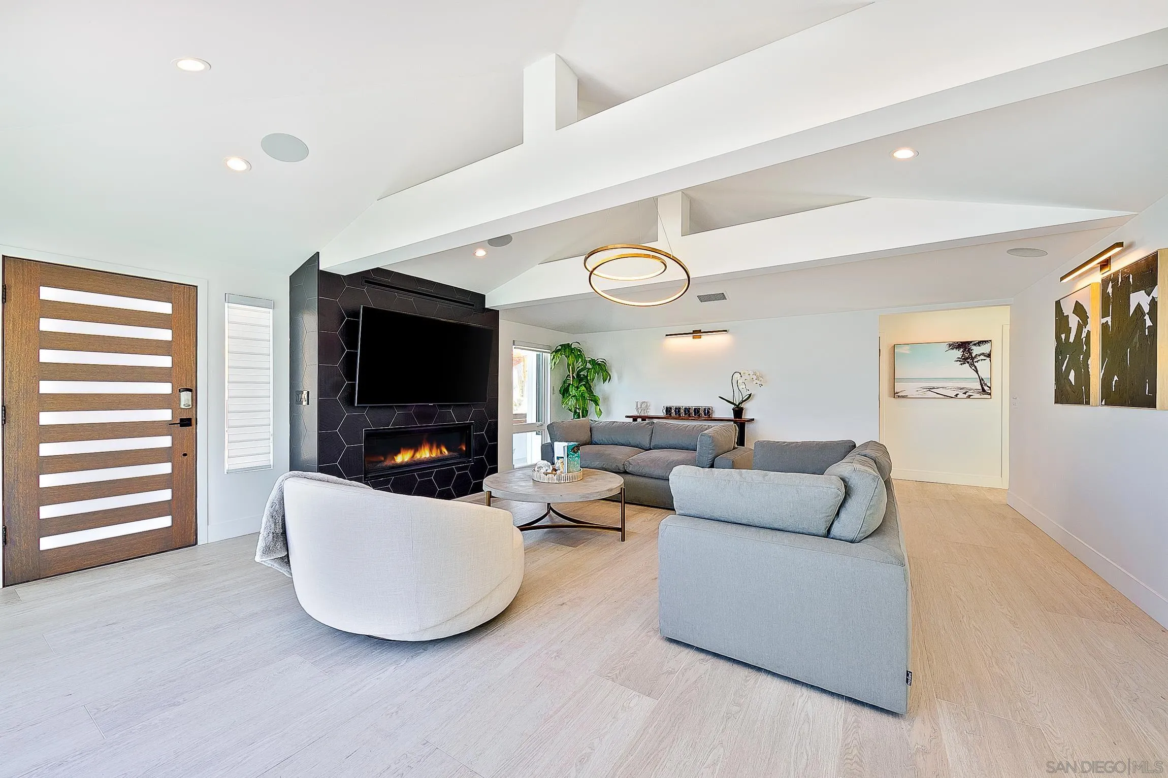 303 Sea Lane La Jolla, CA 92037 - Photo 7 of 61 a living room with furniture and a flat screen tv