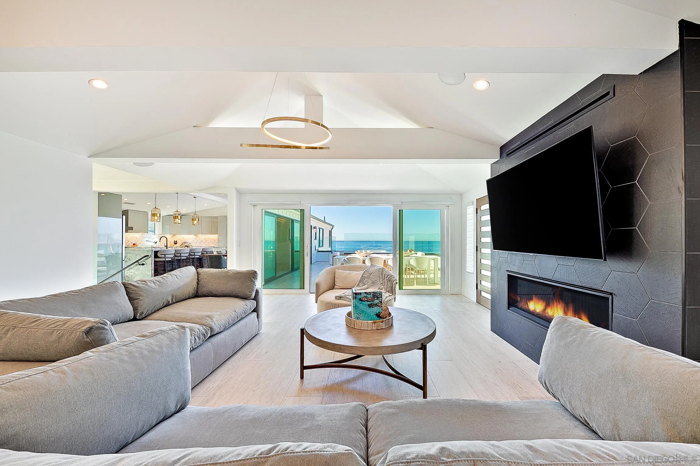 303 Sea Lane La Jolla, CA 92037 - Photo 9 of 61 a living room with furniture and a flat screen tv