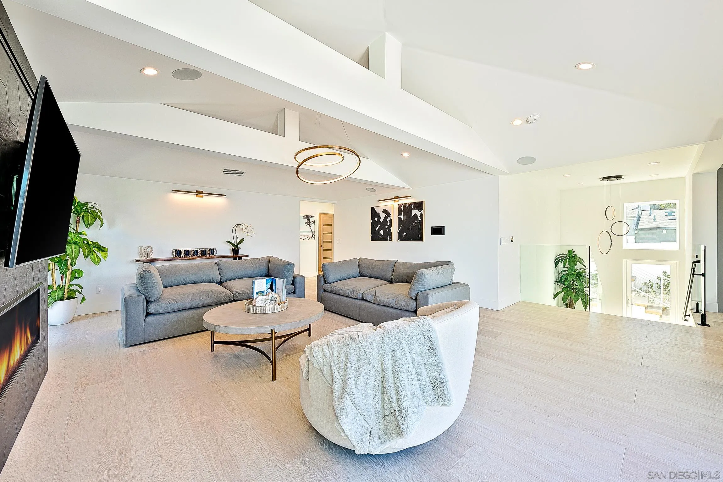303 Sea Lane La Jolla, CA 92037 - Photo 10 of 61 a living room with furniture and a flat screen tv