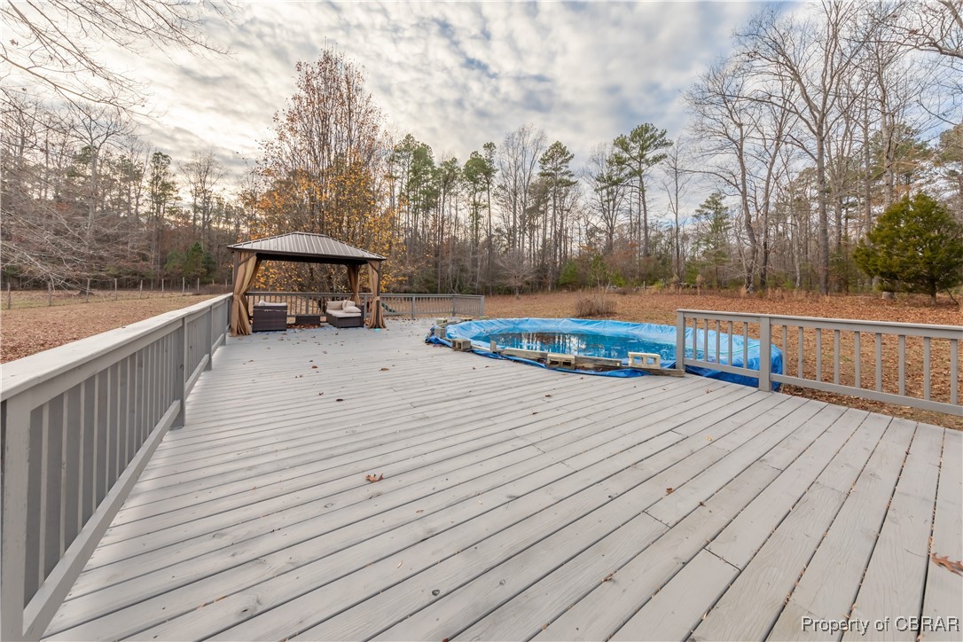 9534 Gee Farm Road Gloucester, VA 23061 - Photo 37 of 48 Deck with a covered pool and a gazebo