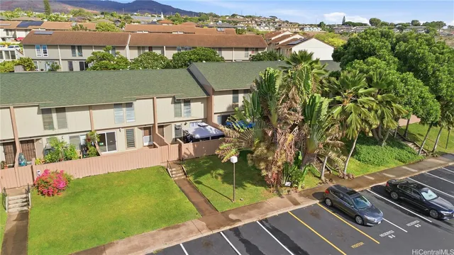 an aerial view of a house with a garden