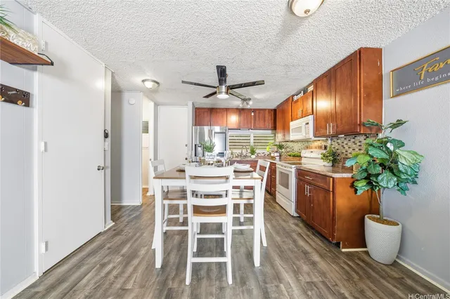 a kitchen with a table and chairs