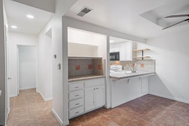 a bathroom with a sink a mirror and a shower