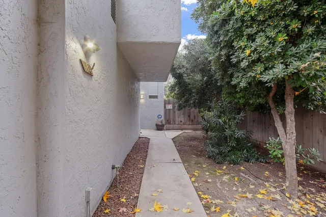 a view of a pathway with a yard