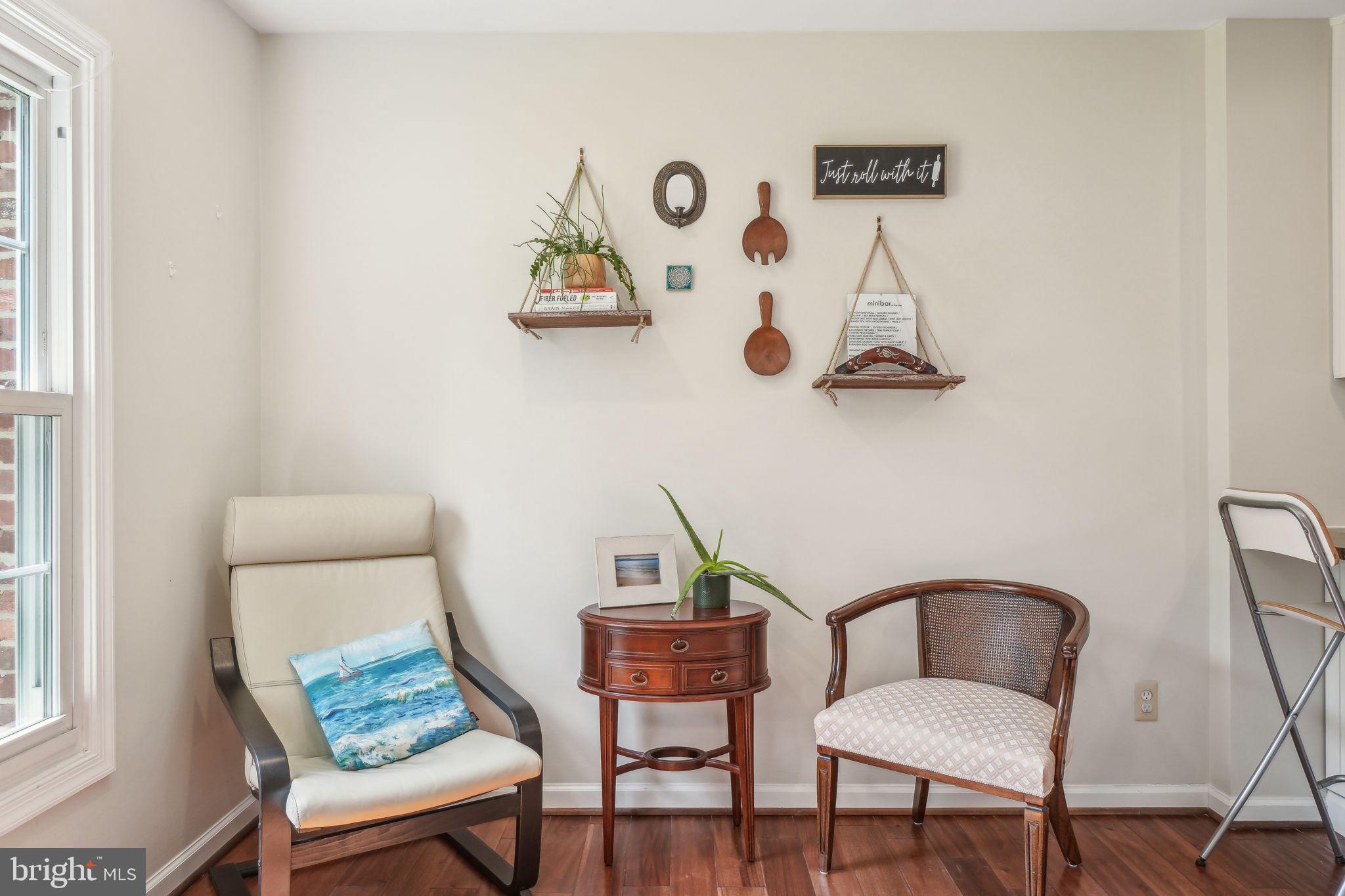 8248 Carrleigh Parkway Springfield, VA 22152 - Photo 12 of 45 a view of a workspace with furniture and wooden floor
